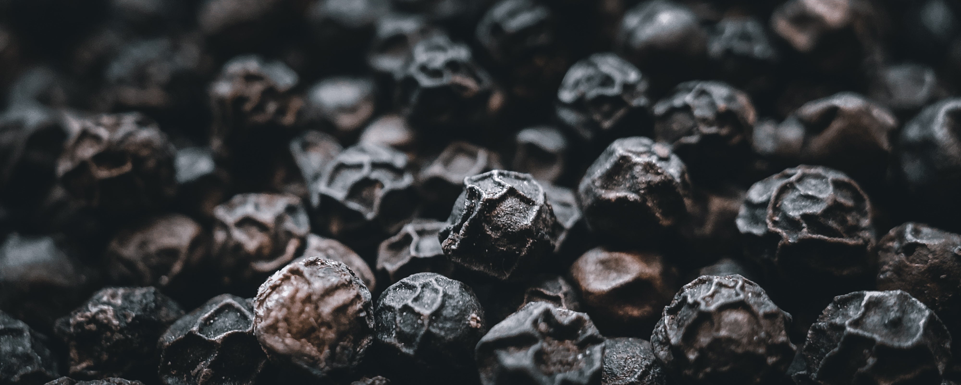 Macro photo of full black pepper kernels